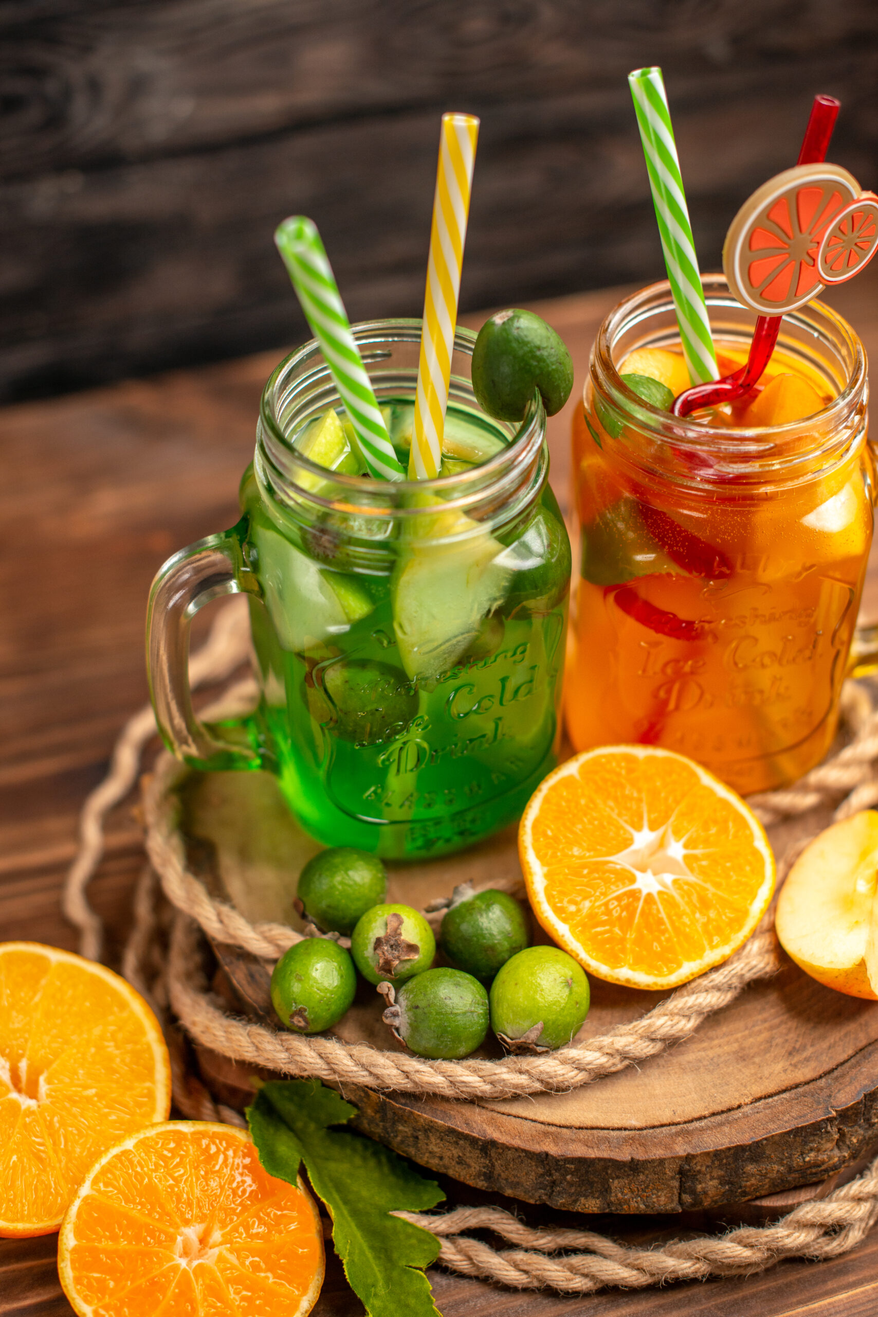 close-up-view-delicious-fresh-juices-fruits-wooden-tray-brown-background